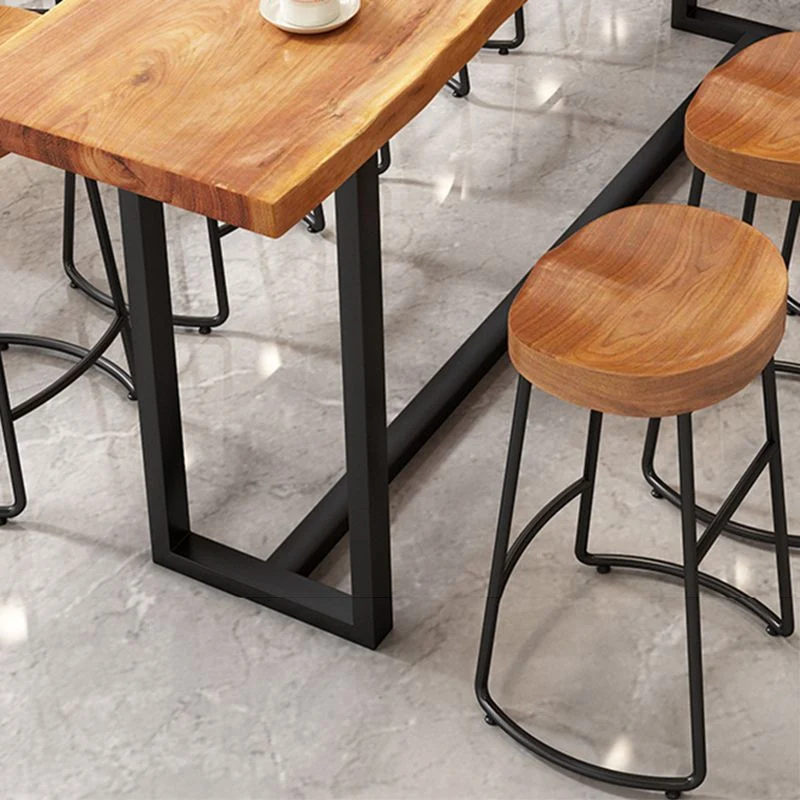 Moderne armloze rugloze tegenkruk, ijzeren keukenbarkruk met houten zitting en pedaal Clearhalo